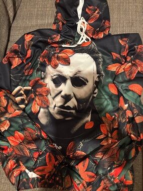 Graphic Horror Mask Hoodie with Orange  & Green Leaf Print